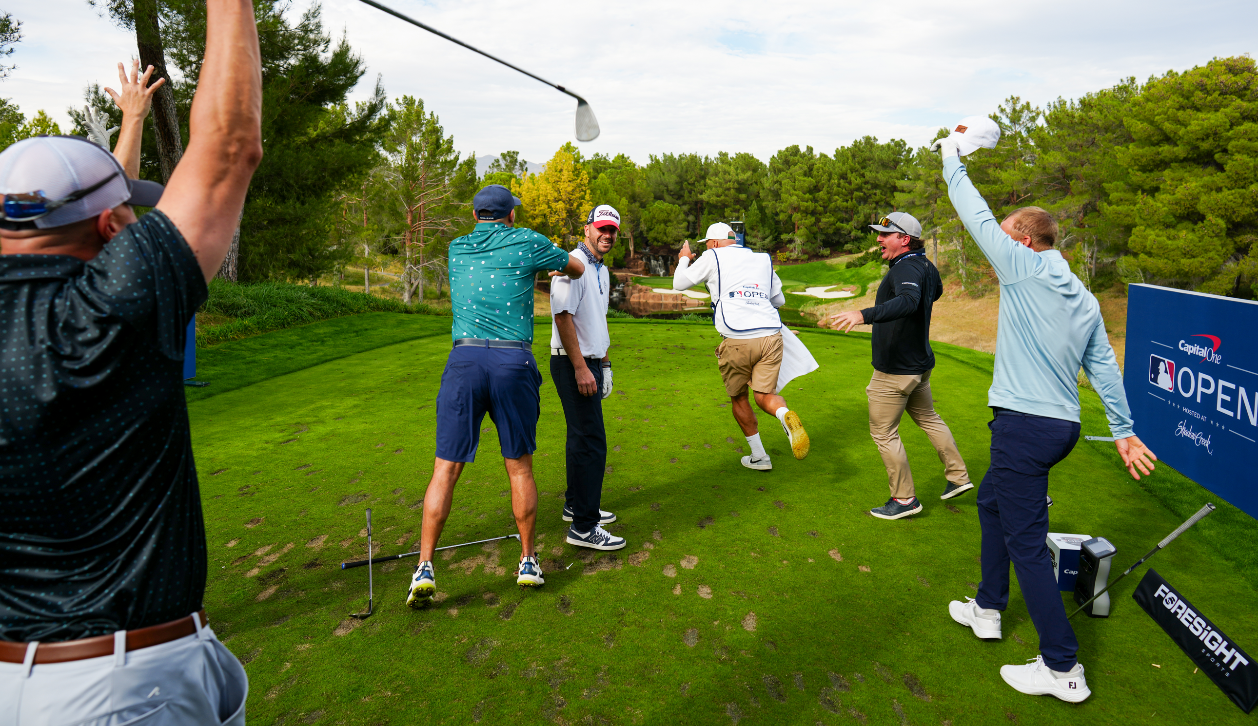 Several golfers celebrate their hole in ones